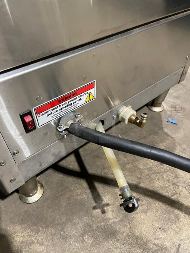 Fecto Commercial Series Automatic Coffee Brewer, Model CBS2142XTS, with power and water connections visible, mounted on legs.