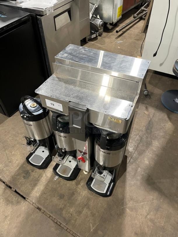 Fecto CBS-2142-XTS automatic coffee brewer with three satellite air pots, excellent condition, on legs, model tag visible.