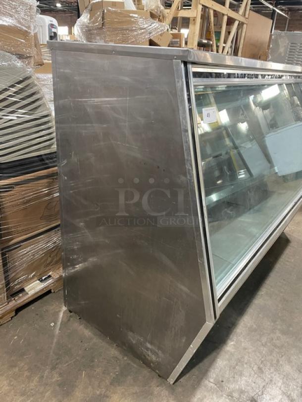 Leader Commercial Stainless Steel Refrigerated Merchandiser, Model HDL72SC, with slanted glass, adjustable shelving, rear sliding doors.