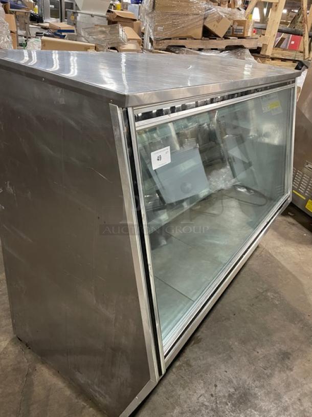 Leader HDL72SC refrigerated display showcase, stainless steel, slanted glass, adjustable shelves, rear sliding doors.