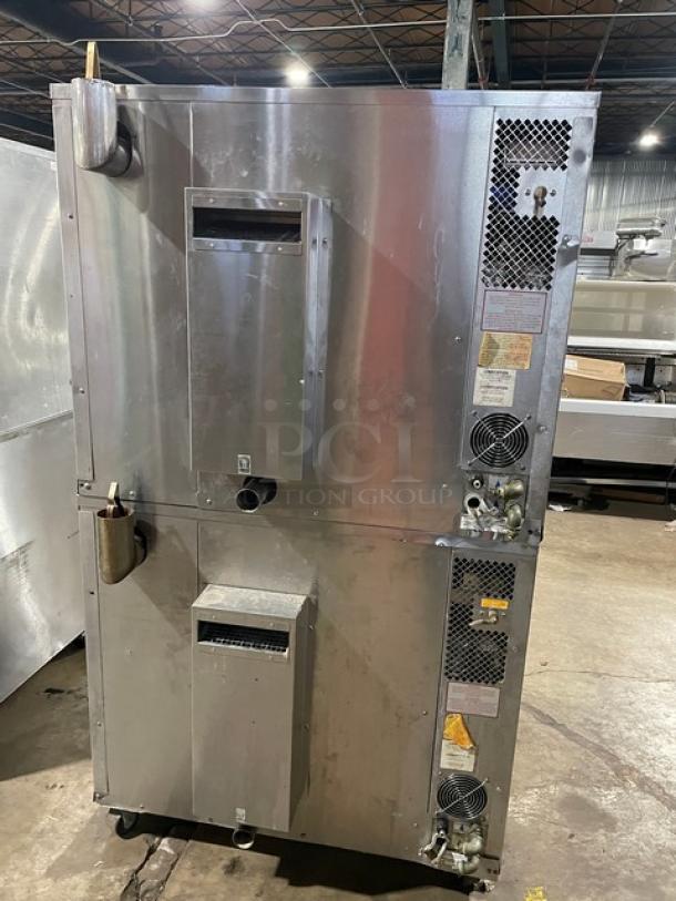 Blodgett stainless steel commercial double-stacked convection oven on casters, natural gas powered, features digital controls and a wired oven rack.