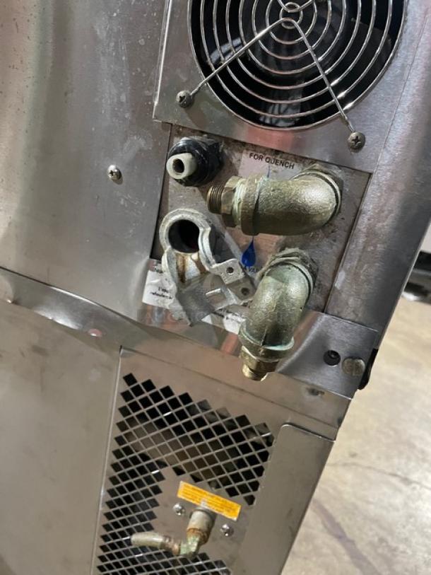 Blodgett stainless steel natural gas convection oven back panel with fan, vents, and fittings on casters.