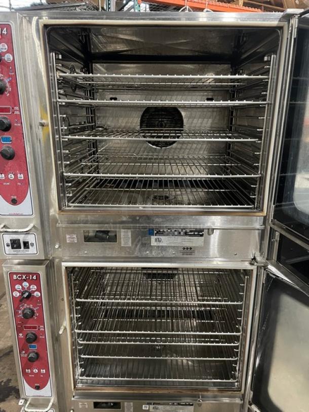 Blodgett double-stacked convection oven, stainless steel, natural gas-powered, with digital controls, wired racks, on casters.