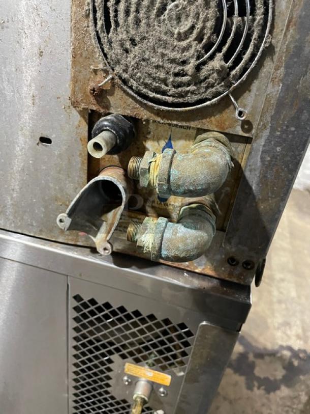 Blodgett commercial stainless steel double-stacked convection oven, natural gas powered, digital controls, on casters. Rust visible around gas connections; check condition.