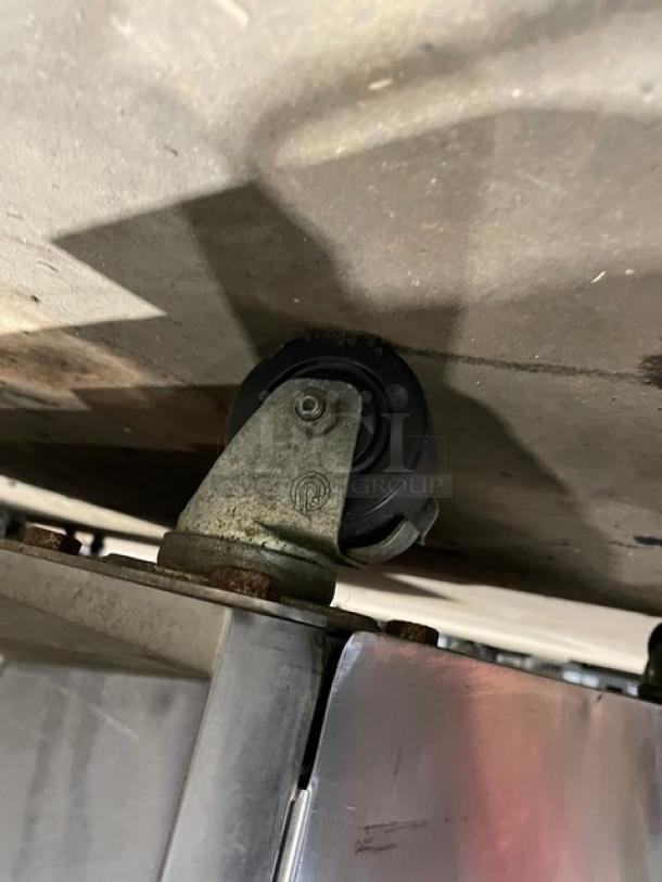 Blodgett stainless steel double stacked convection oven with casters, digital controls, and wired oven rack.