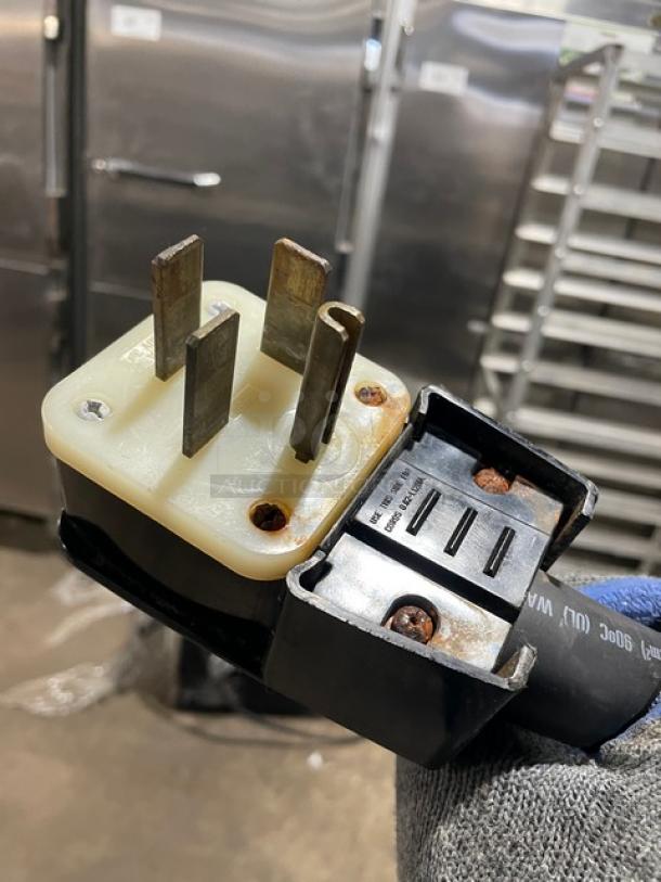 Close-up of power plug for AccuTemp Evolution Series Convection Steamer, showing wear. Model: E62083E15000200, 208V, 3 Phase.