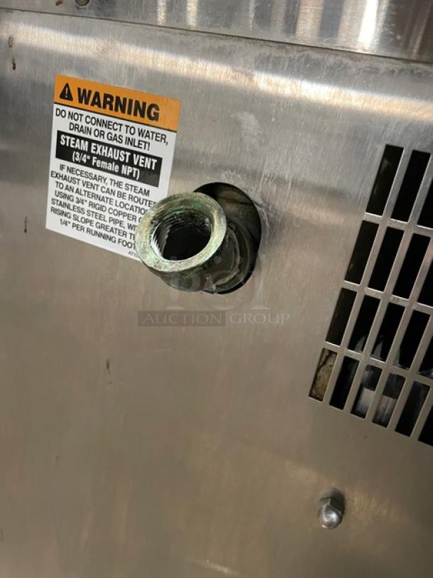 AccuTemp Evolution Series E62083E15000200 stainless steel convection steamer with steam exhaust vent, warning label visible.