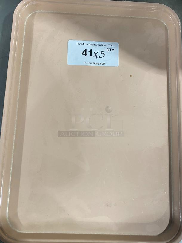 Camtray commercial tan serving tray, durable plastic, slight wear. Label: "41 x 5 Qty" from PCIAuctions.com. Great for fast food use.