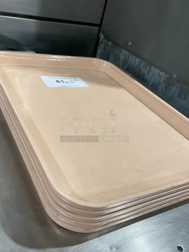 Camtray commercial tan fast food serving trays stacked, slight wear. Tag reads "41X5". Durable and ideal for food service.