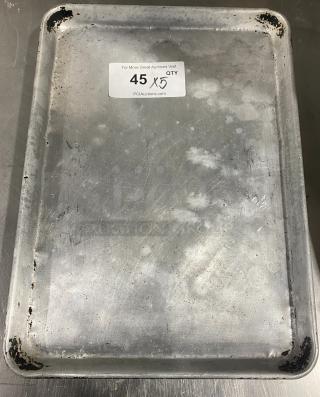 Commercial stainless steel full-size sheet pan, used condition, visible wear. Tag indicates quantity "5X".