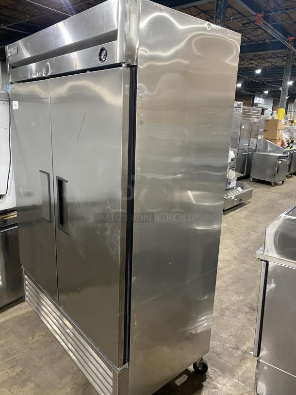 True T-49F stainless steel 2-door commercial freezer, Energy Star certified, poly-coated racks, casters, model SN 8938996.