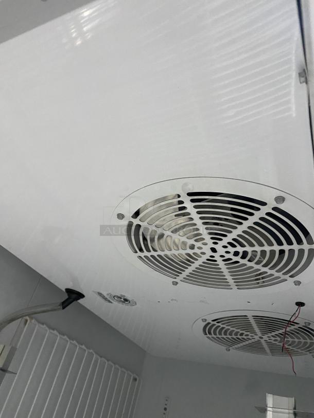 True T-49F commercial stainless steel 2-door reach-in freezer interior, featuring poly coated wired racks, Energy Star certified.