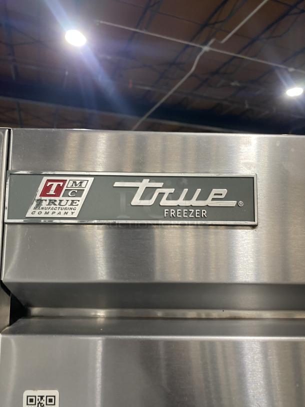 True T-49F Commercial Stainless Steel 2-Door Reach-In Freezer, Energy Star, with poly-coated racks, on casters.
