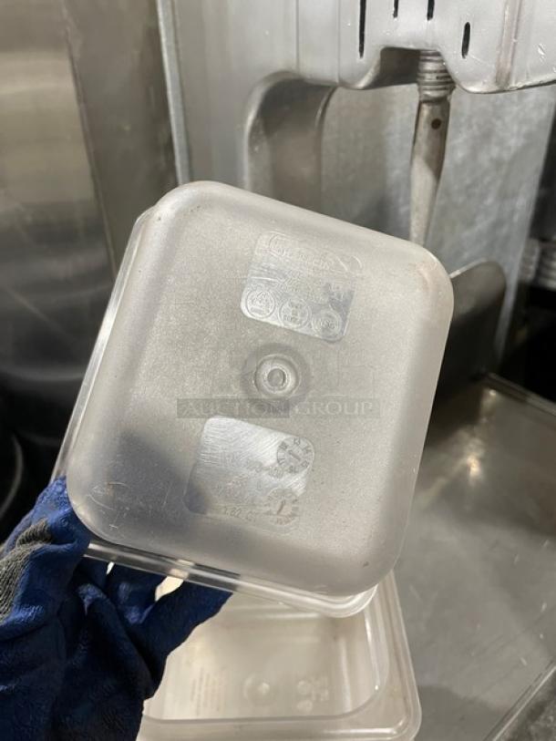 Characin commercial clear polycarbonate 1.62 Qt food storage container with visible branding and care instructions.