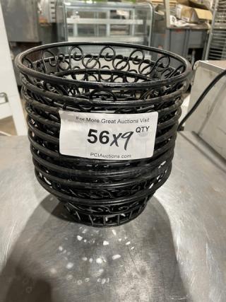Commercial black round wired basket, decorative patterns, stacked in quantity. Tag reads "56X9 QTY" at PCIAuctions.com.