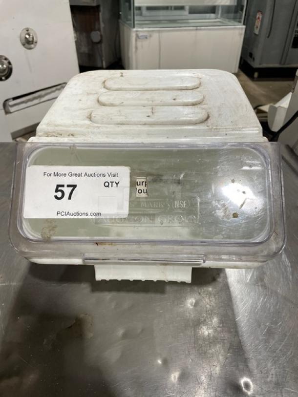 Commercial white ingredient bin with a clear lid, sticker marked with "57," used condition, suitable for kitchen storage.
