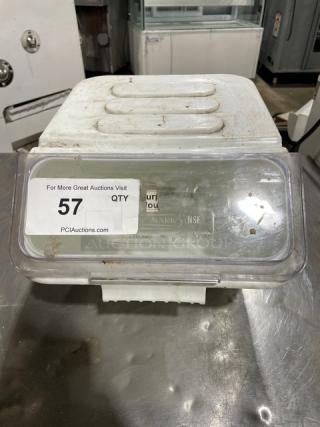 Commercial white ingredient bin with a clear lid, sticker marked with "57," used condition, suitable for kitchen storage.