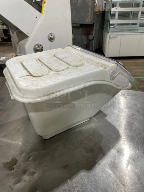 Commercial white ingredient bin with clear sliding lid, used condition. Ideal for kitchen storage.