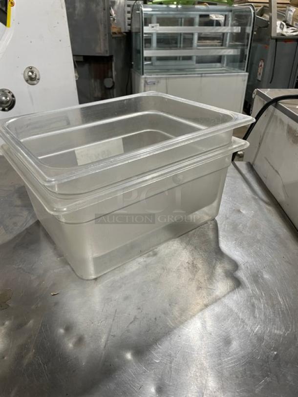 Cambro clear polycarbonate 9.3 qt food storage container in good condition on a metal surface. Ideal for commercial use.