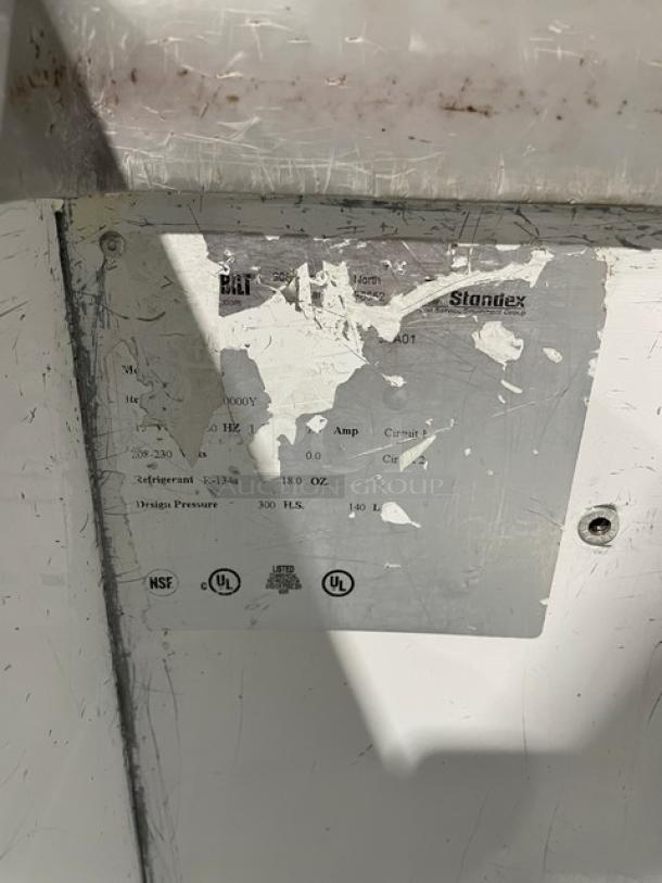 Master-Bilt commercial ice cream dipping cabinet with sneeze guard, 115V. Visible label shows wear but includes UL and NSF certifications.