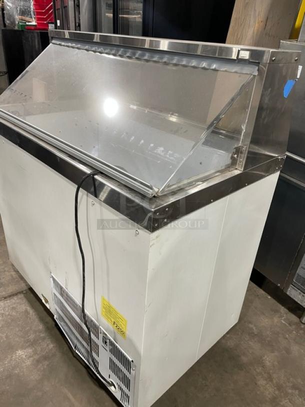 Master-Bilt commercial white ice cream dipping cabinet with sneeze guard, 115V, in good condition, stainless steel accents.