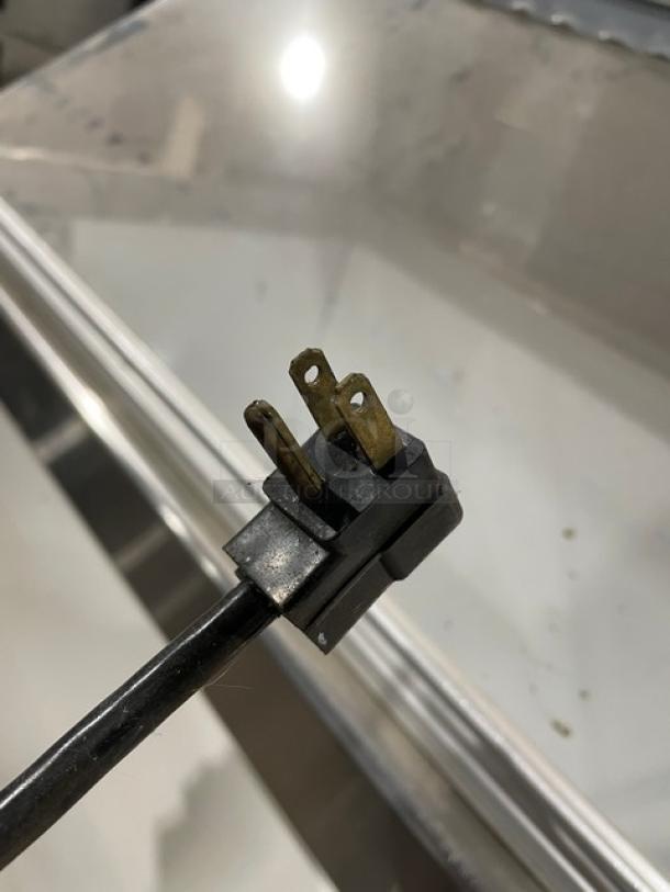 Master-Bilt commercial white ice cream dipping cabinet with sneeze guard and 115V plug.