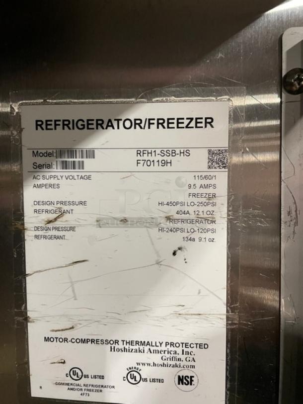 Hoshizaki RFH1-SSB-HS commercial stainless steel half door fridge/freezer combo, digital controls, on casters, model/serial tags visible.
