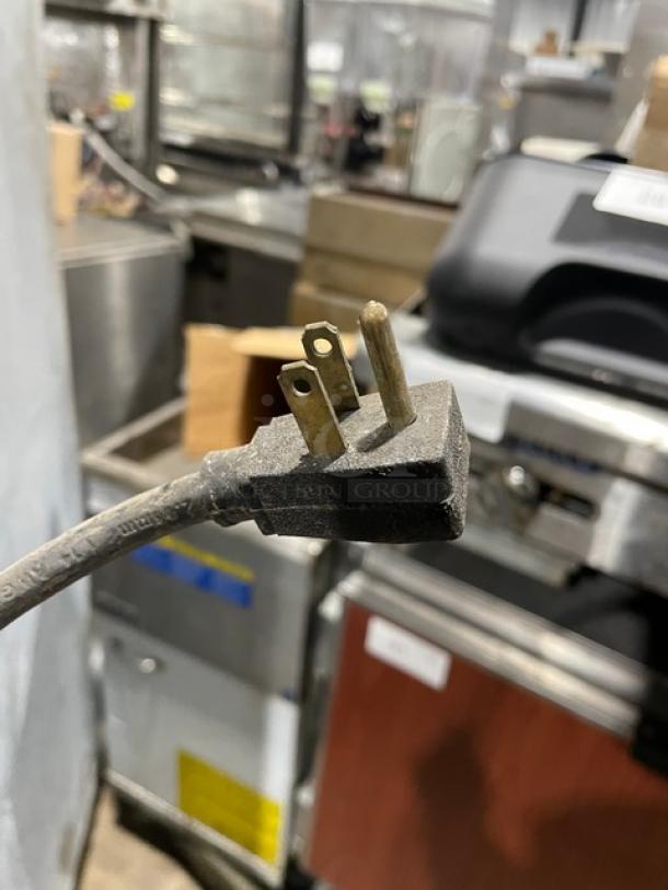 Power plug of a Hoshizaki RFH1-SSB-HS commercial refrigerator/freezer, 115V, 1 Phase, on casters.