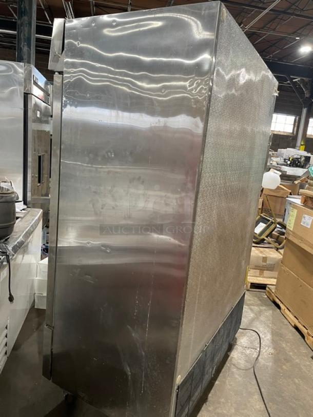 Arctic Air AF49 commercial stainless steel 2-door reach-in freezer, 115V, on casters, visible surface wear.