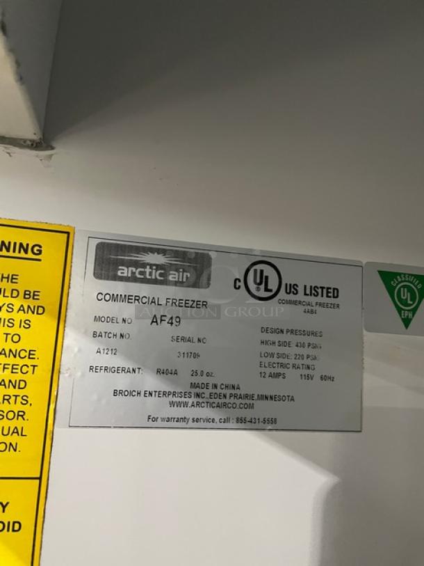 Arctic Air AF49 commercial freezer label, showing model, serial number 311709, 115V, and UL listing.