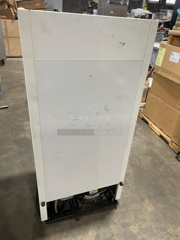True Commercial White Glass Door Beverage Merchandiser, Model GDM-10SSL-LD, single swing door, rear view, some wear.