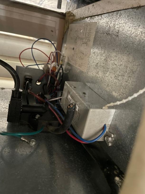 Interior wiring and components of True Commercial Refrigerator, Model GDM-10SSL-LD, with visible wiring connections and serial label.