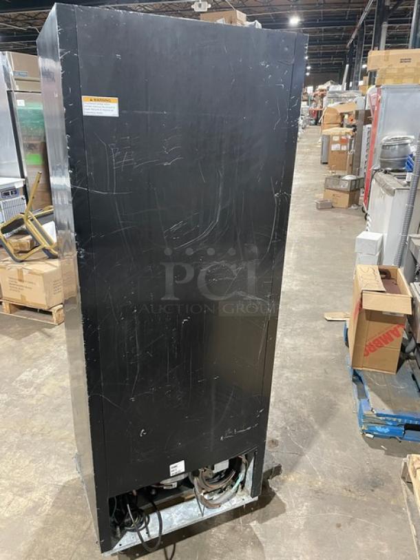 Beverage Air MT12 black commercial single glass door merchandiser cooler, model SN 7695318, 115V, 1 phase, some surface wear.