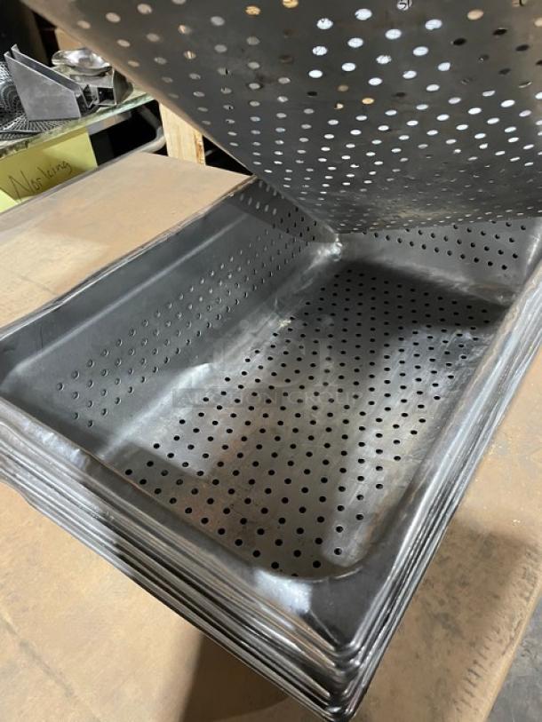 Commercial stainless steel perforated steam table pan, full-size, stackable, durable, lightly used condition.