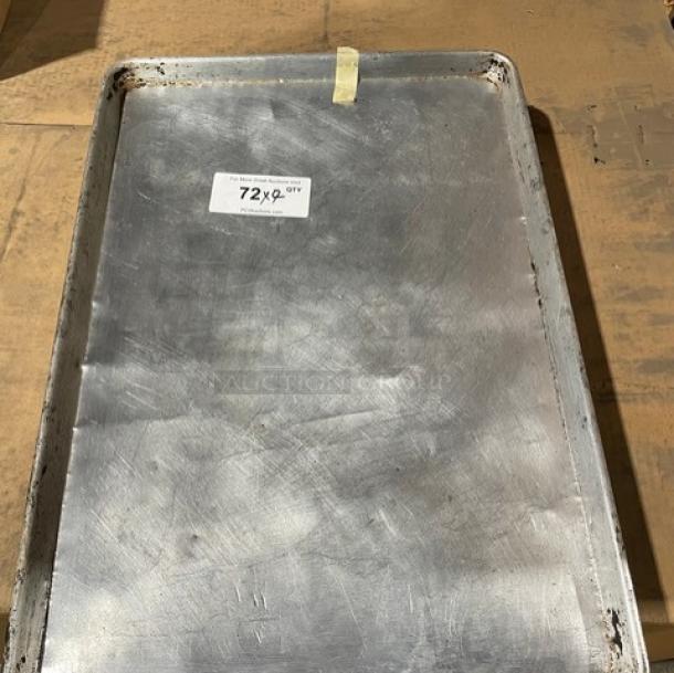 Commercial aluminum full-size sheet pan, used, with label "72x9 QTY." Durable, suitable for large-scale baking.