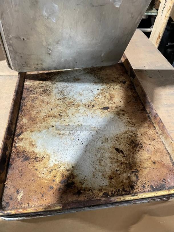Commercial aluminum full-size sheet pan with visible wear and patina, used condition, ideal for bulk kitchen needs.