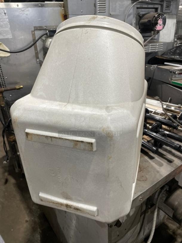 Commercial white ingredient bin, durable plastic, with ergonomic design. Used condition with visible wear marks.