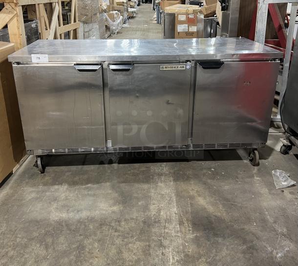 Beverage-Air commercial stainless steel 3-door 72" worktop refrigerator, model WTR72AY, on casters, pre-owned condition.