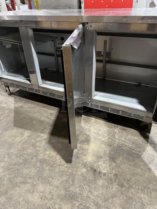 Beverage-Air WTR72AY 72" stainless steel 3-door worktop refrigerator, model 9707469, on casters, open door view.