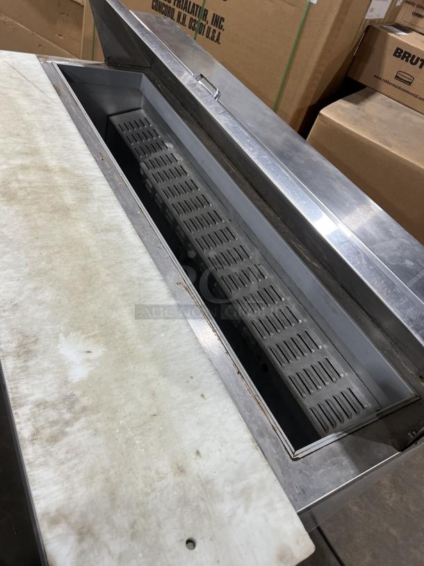 Continental SW60-16 stainless steel refrigerated sandwich prep table, dual doors, showing open lid and interior condition.