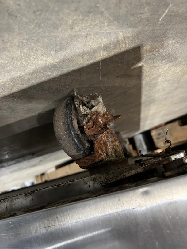 Continental Commercial Refrigerated Sandwich Prep Table, Model SW60-16, visible rust on caster wheel, fair condition.