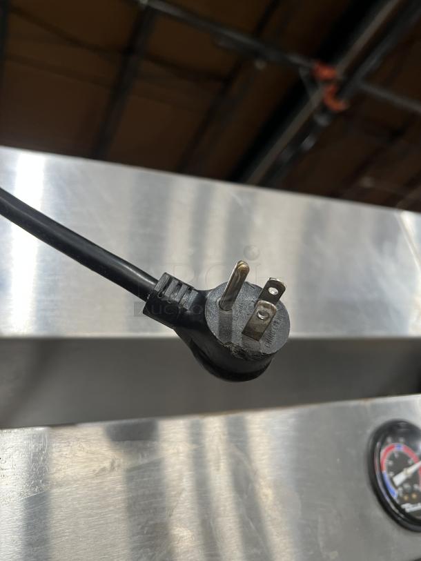 True T-19F stainless steel commercial reach-in freezer with poly-coated racks, on casters. Serial number 9037182. 115V, 60Hz, 1 phase.