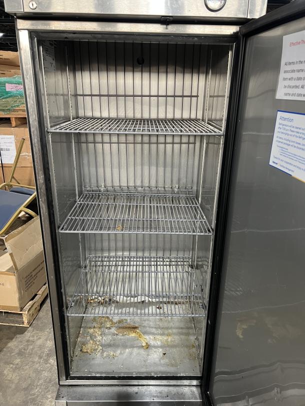 True T-19F single door reach-in freezer, stainless steel with poly coated racks, on casters. Model: T-19F, Serial: 9037182, 115V, used condition.