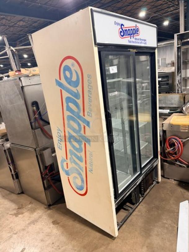 True GDM45 glass sliding door cooler merchandiser with Snapple branding. 115V, 1 phase. Good condition for displaying beverages.