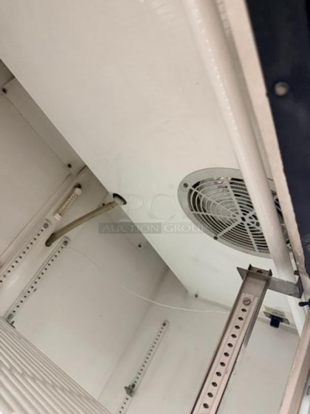 True GDM45 glass sliding door cooler interior, showing fan and shelving mounts, used condition, 115V 1 Phase.