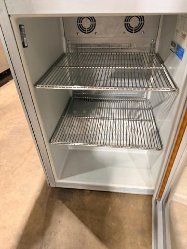 Commercial stainless steel RedBu beverage cooler, Model RBGDCT, single glass door, LED lit, dual shelves, excellent condition.