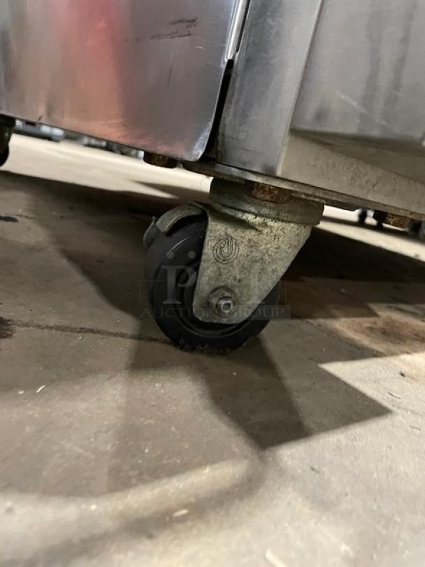 Blodgett stainless steel double stacked convection oven with casters, digital controls, and wired oven rack.