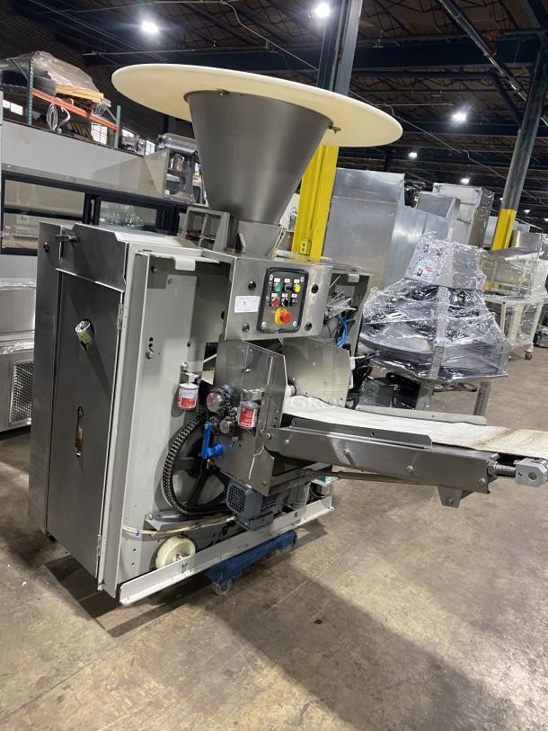 Benier commercial stainless steel dough divider bakery machine, industrial model, used condition, with control panel and hopper.