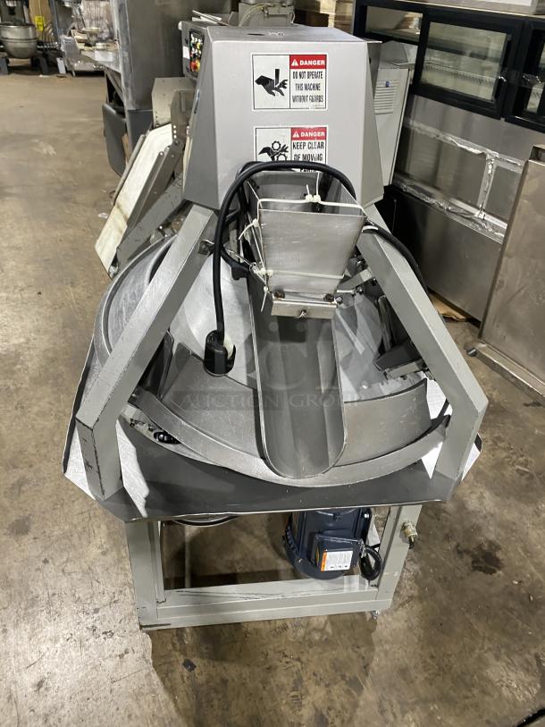 Benier commercial stainless steel conical dough rounder on casters, featuring warning labels and control panel, in used condition.