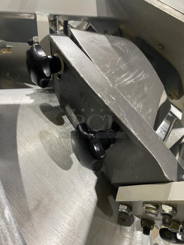 Benier commercial stainless steel conical dough rounder machine on casters, features durable build, showing adjustment knobs.